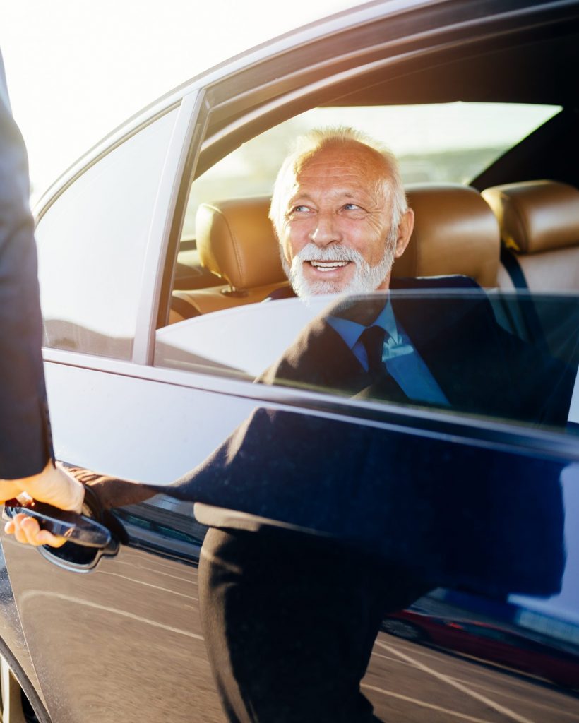 Senior,Business,Man,Sitting,In,His,Limousine.,Business,Concept.,Back